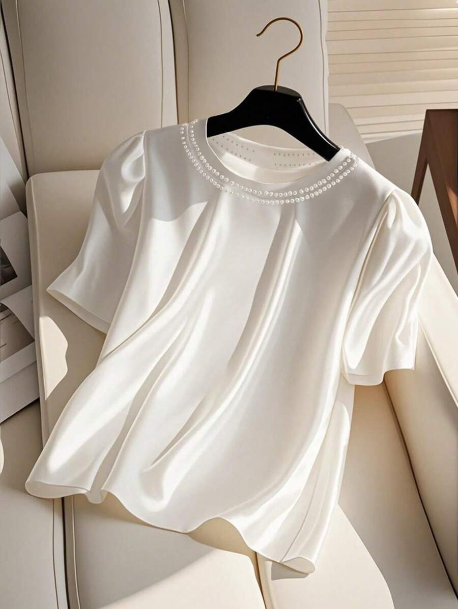 Blusa holgada de mujer con cuello de perlas